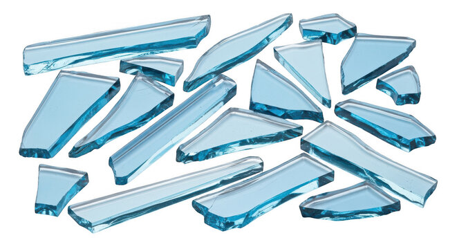 Scattered sharp shards of light blue tempered glass isolated on a transparent background