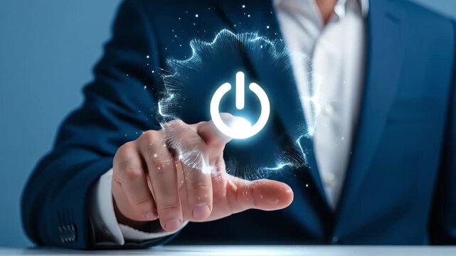 Close-up of a man's finger pressing a glowing power button on a digital interface
