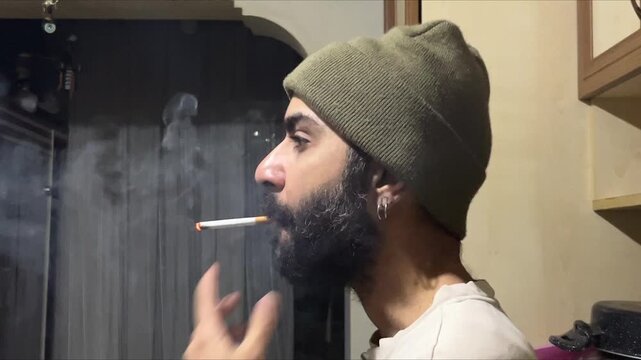 Bearded Man Lighting Cigarette in Contemplative Pose, Embodying Depression, Anxiety, Loneliness and Mental Health Inner Conflicts