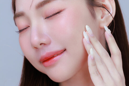 Close Up Asian Beauty Woman with Korean Glass Skin and Smooth Face Texture.
