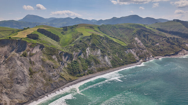 Coastal cliffs and ocean aerial panoramic landscape. Flysch Begiratokia - Baratzazarrak. Deva, Gipuzkoa, Spain.