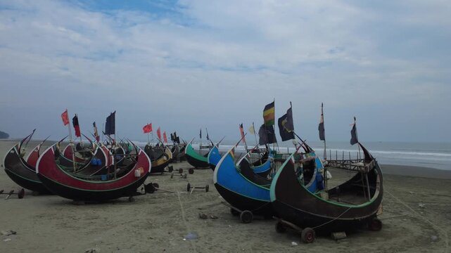 Traditional Wooden Fishermen's fishing boat, Teknaf Coxs bazar, Bangladesh. Colorful Wooden Fishing Boat On a Cox's Bazar Sea Beach With Blue Background in Bangladesh 