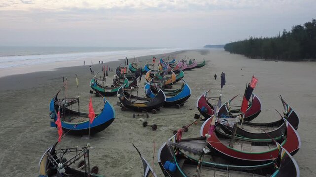 Traditional Wooden Fishermen's fishing boat, Teknaf Coxs bazar, Bangladesh. Colorful Wooden Fishing Boat On a Cox's Bazar Sea Beach With Blue Background in Bangladesh 