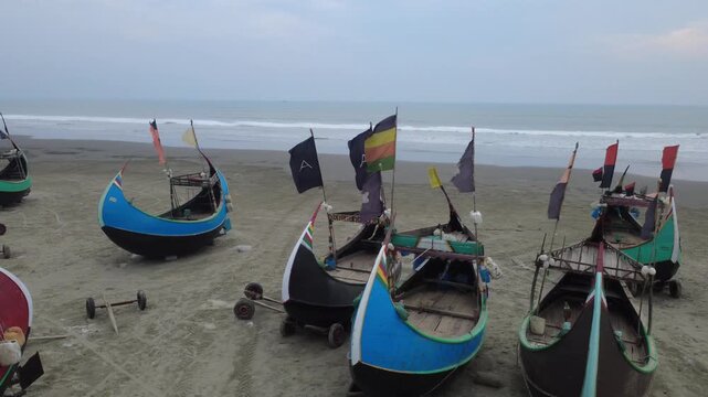 Traditional Wooden Fishermen's fishing boat, Teknaf Coxs bazar, Bangladesh. Colorful Wooden Fishing Boat On a Cox's Bazar Sea Beach With Blue Background in Bangladesh 