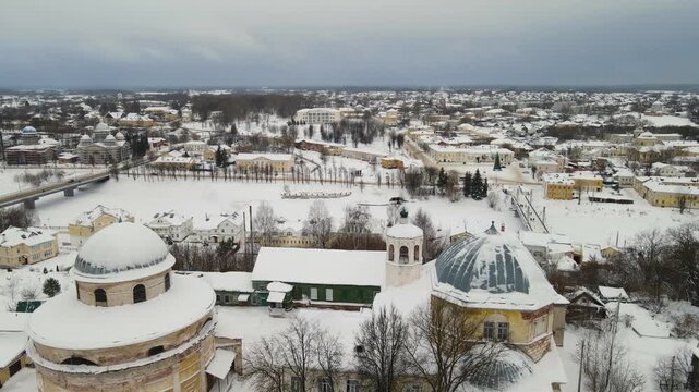 Aerial drone forward flight over the Transfiguration Cathedral and city panorama of Torzhok in winter