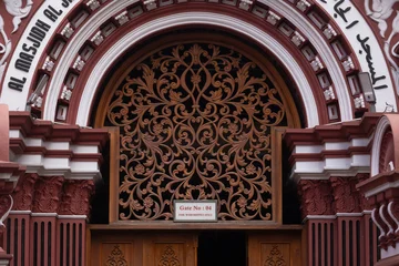 Fototapeten Zauberwald Intricate wood carving on Gate 4 of the Red Mosque in Colombo, Sri Lanka. Architectural detail of Jami Ul-Alfar.  © Сергей Дудиков