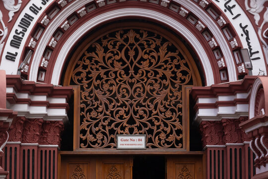 Intricate wood carving on Gate 4 of the Red Mosque in Colombo, Sri Lanka. Architectural detail of Jami Ul-Alfar.