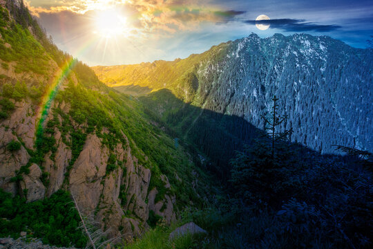 Day meet night. Valley on summer solstice in mountains. Sun and moon over gorgeous mountainous landscape at twilight. Rocky cliffs and forested slopes under epic sky. Scenery of mountain ridge