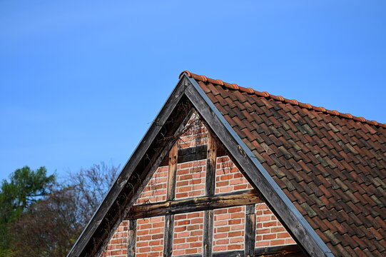 Triangular finial of the house against the blue sky