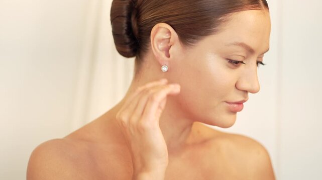 Woman adjusting earring