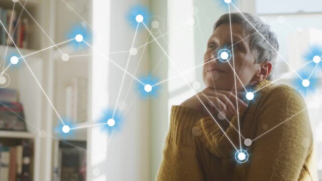 Mature woman resting chin by window glowing network starting at shelf overlaying face mapping tech