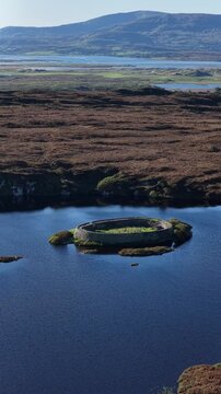 Aerial of the historic Ringfort at Lough Doon, Portnoo, County Donegal, Ireland