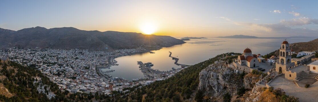 Sunrise, greek-orthodox monastery Saint Savvas, town view of Kalymnos, harbour and sea, Kalymnos, Dodecanese, Greece