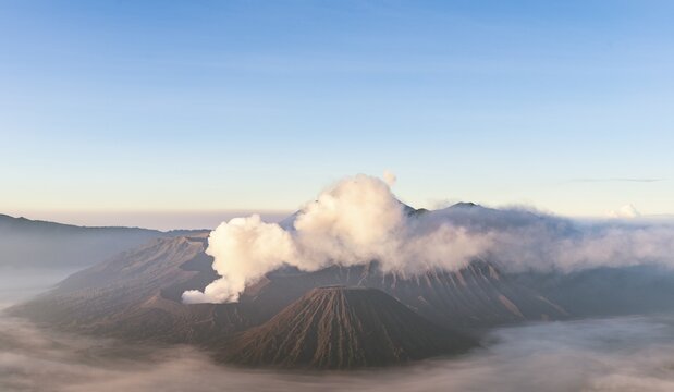 Smoking Mount Bromo, volcano at sunrise, Mount Batok, Mount Kursi, Mount Gunung Semeru, Bromo Tengger Semeru National Park, East Java, Indonesia