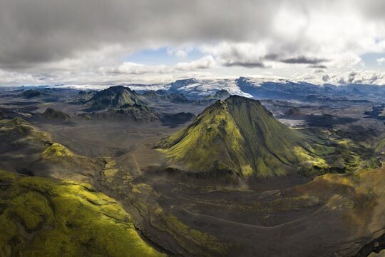 Aerial view, Mountains covered with moss, glacier Myrdalsj&ouml;kull in the back, Icelandic highlands, Iceland