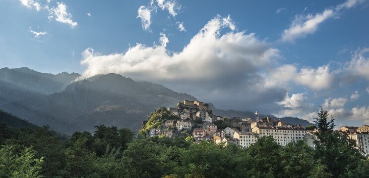 Historic centre in front of mountains, Corte, Corsica, France