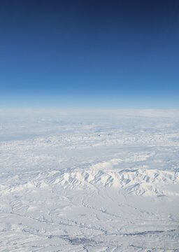 View of mountains and snowy landscape from the airplane, airplane wing of an Airbus A380, aerial view, Anatolia, Northeastern Turkey, Turkey
