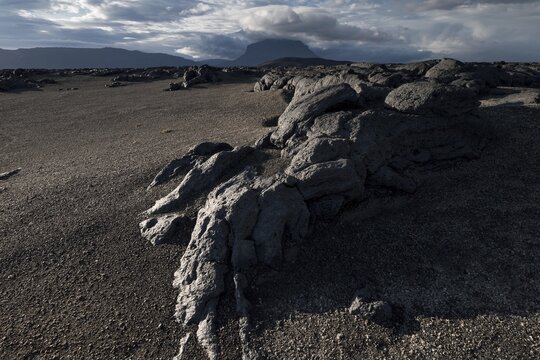 Old lava flow, volcanic landscape, in the background table volcano Her&eth;ubrei&eth; or Herdubreid, Icelandic Highlands, Iceland