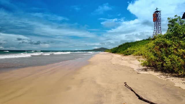 Pleasant walk by the empty sandy beach on cloudy day. Beautiful coast of Isabel Island, Galapagos.
