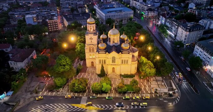 The Cathedral of the Assumption in Varna, Aerial view by night with city lights panorama