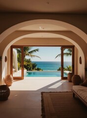 Obraz premium Luxurious villa interior with plunge pool overlooking ocean. Archway entrance frames blue sea view and palm trees. Modern minimalist design offers tropical vacation escape and serene relaxation.