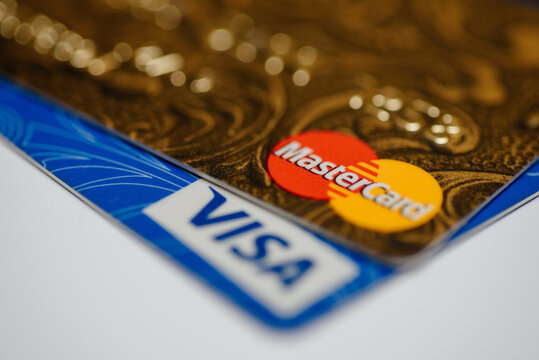 KIROV, RUSSIA - MAY 12, 2026 Visa logo, MasterCard logo, pile of multicolor bank cards, debit and credit cards, banking service concept, close-up view, selective focus