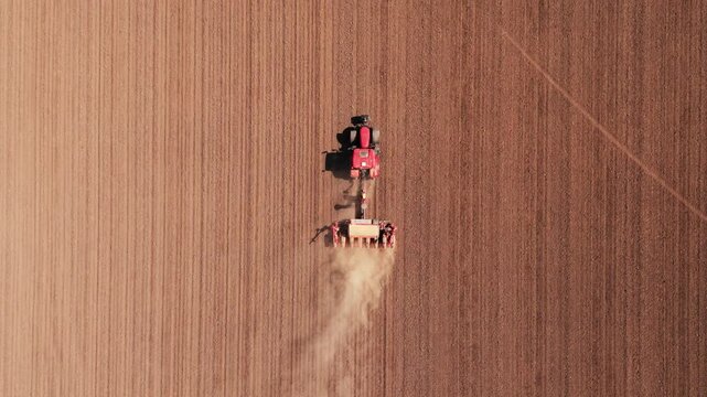 Tracking Shot of Precision Farming and Tractor Seeding