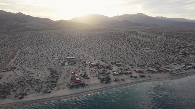 Witness the late afternoon views of Bahia de Los Angeles with the sun setting over the Sea of Cortez and the surrounding landscape.