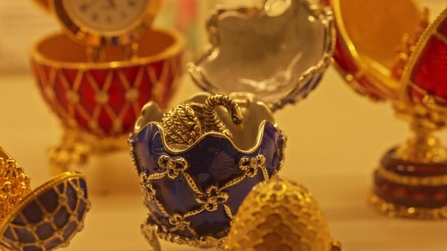 Beautiful collection of imperial decorative jeweled eggs inspired by the famous faberge masterpieces, showcasing intricate enamel, gold filigree, and precious stones with a surprise inside