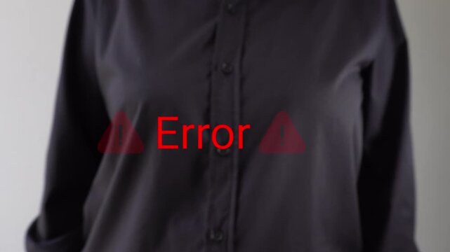 Businessperson pointing towards an "Error" animation with warning signs. Warning message of a computer error.