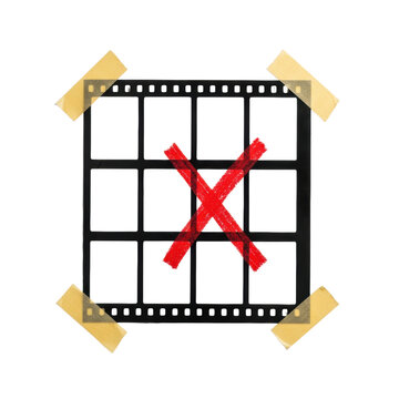 highly detailed, photorealistic flat lay of a vintage analog matte fiber contact sheet with blank b&w 35mm frames secured by golden tape on white copy space, marked by a thick red 'x' rejection.