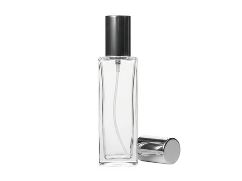 Clear glass perfume bottle with black cap and atomizer on a white background