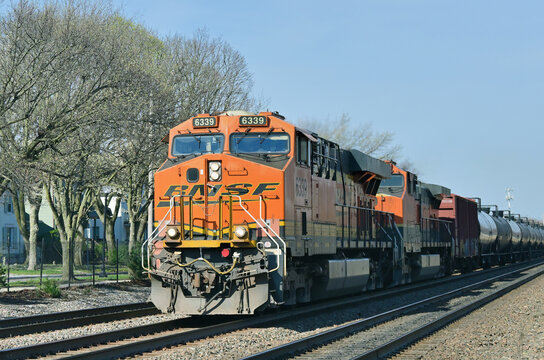A pair of locomotives provide front-end power for a Burlington Northern Santa Fe eastbound freight train passing through Chicago's southwestern suburbs.