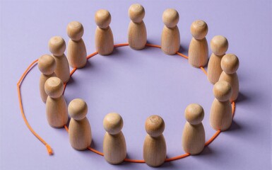 Obraz premium Wooden figures circle linked by orange string symbolizing unity and