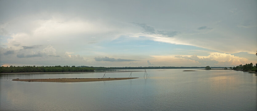 Sebung River on Bintan island evening panorama with fishing gear on the sandbank in Indonesia