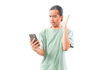 Fototapeta premium young handsome Indonesian, Asian man in green shirt stress with headache in debt, depression or anxiety isolated on white background. migraine, injury or sore head in burnout or frustration