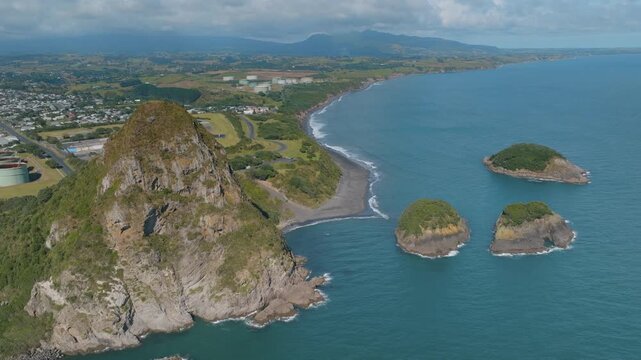 Aerial view of Paritutu Rock and the Sugar Loaf Islands, a popular tourist destination, in New Plymouth, Taranaki, New Zealand. Coastal scenery and landscape.