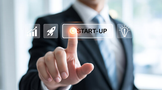 Businessman in suit pressing start up button with icons for growth launch and innovation
