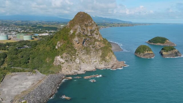Coastal view of Paritutu Rock and the Sugar Loaf Islands, a popular tourist destination in New Plymouth, Taranaki, New Zealand. Scenic landscape.