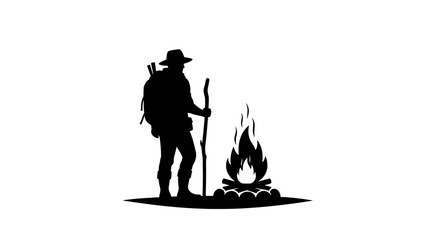 Hiker stands beside a burning campfire while wearing a backpack and holding a wooden walking stick. © NGLARANGAN