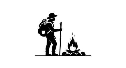 Hiker with a backpack and walking stick stands beside a burning campfire to symbolize wilderness exploration and outdoor adventure. © NGLARANGAN