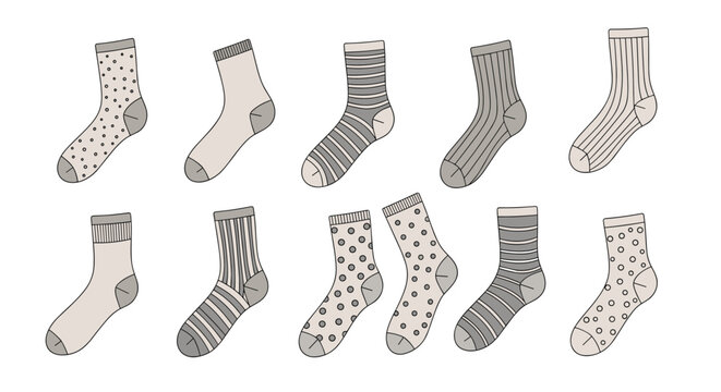 Ten pairs of assorted socks with various patterns including stripes, polka dots, and plain textures in neutral earth colors.