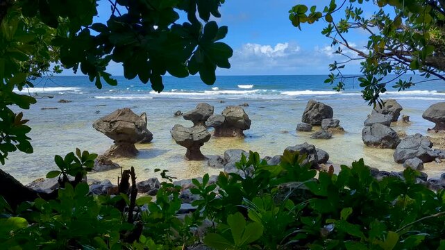 Scenic coastal landscape with eroded rock formations on the Lavena Coastal Walk within Bouma National Heritage Park in Taveuni, Fiji