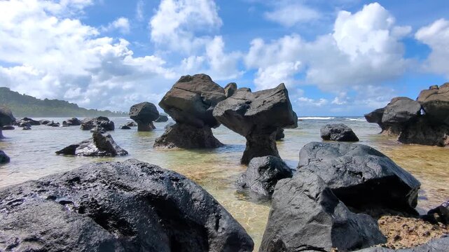 Static view rock erosion formations on the Lavena Coastal Walk within Bouma National Heritage Park on tropical island Taveuni, Fiji