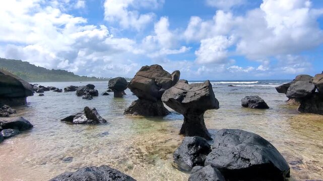 Scenic pan eroded rock formations on the Lavena Coastal Walk, Bouma National Heritage Park on tropical island Taveuni, Fiji