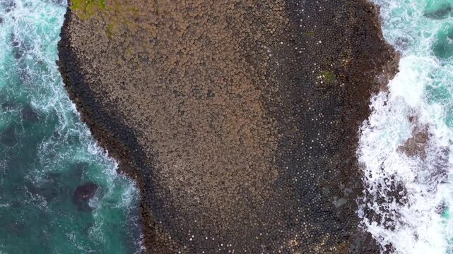 Rising 4K 60FPS aerial video of The Giant's Causeway in Bushmills, County Antrim in Northern Ireland, UK. Produced in 3840x2160 and with Rec709 color.