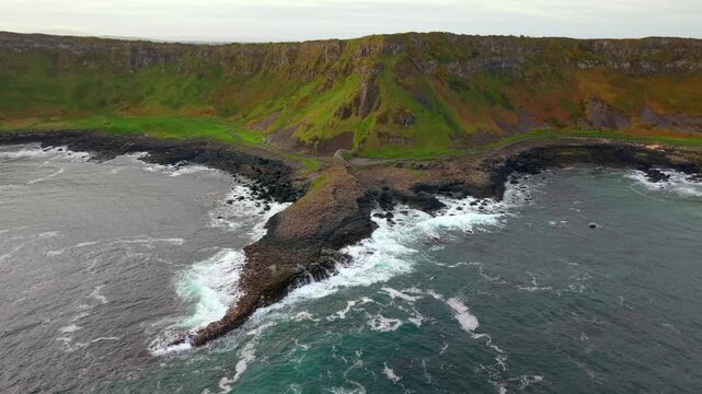 4K 60FPS aerial video of The Giant's Causeway in Bushmills, County Antrim in Northern Ireland, UK at sunset. Produced in 3840x2160 and with Rec709 color.