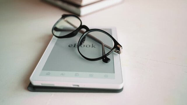 Portable ebook reader with books represents digital knowledge ecosystem. Concept of smart education, information accessibility and modern reading habits in connected world.