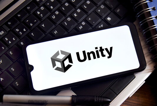 Unity logo on a smartphone screen on a laptop. American video game software development company.