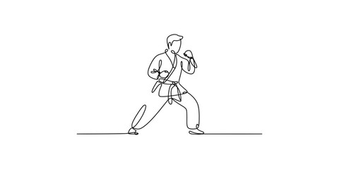 Fototapeta premium Continuous line drawing of a man in a karate uniform performing a stance isolated on white background